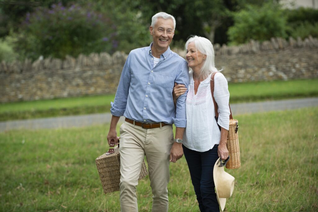 adorable senior couple being affectionate while taking walk